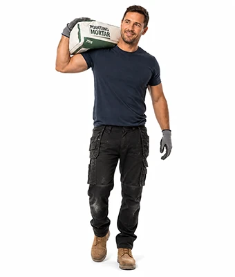 Man carrying a bag of mortar