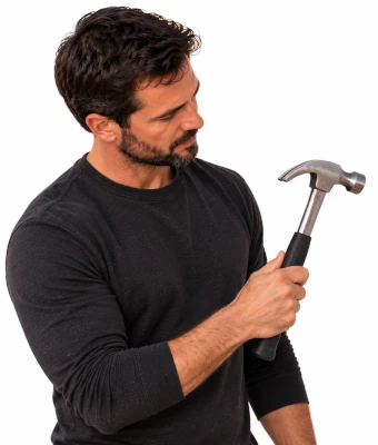 Man holding hammer to assist in hanging outdoor christmas lights