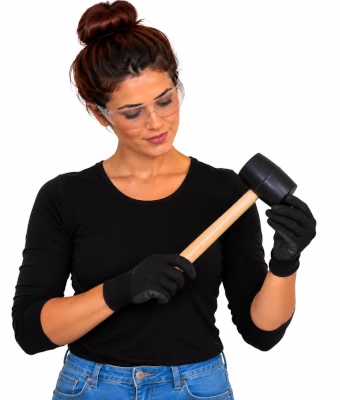 Lady holding rubber mallet to assist in laying click-system laminate flooring