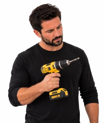 Man holding a drill to refresh your kitchen doors, hinges, and handles