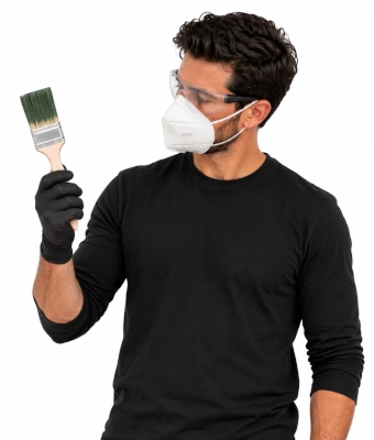 Man holding a paint brush to gloss a front door