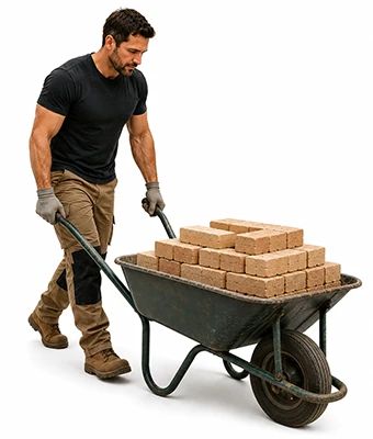 Man pushing a wheelbarrow with bricks