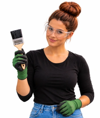 Lady holding a paintbrush to paint rusty metal gates and railings