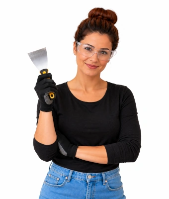 Woman holding a putty knife/scraper to transform your under-stair space into storage
