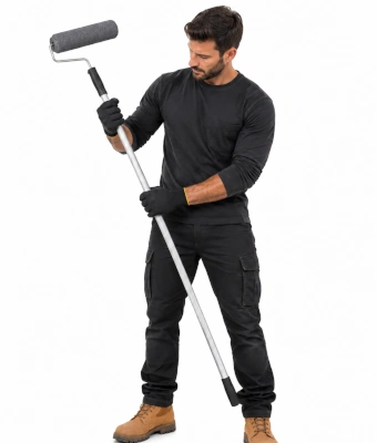 Man holding a roller brush to paint a concrete garage floor